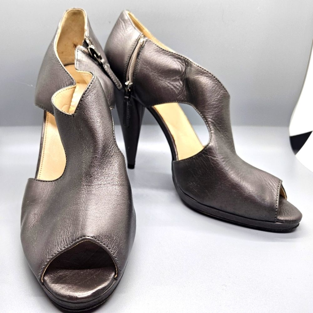 Vintage leather Prada cut out peep toe heels.  Gunmetal